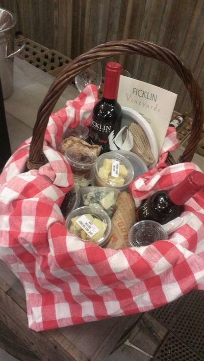 Picnic basket featuring a 375 ml bottle of Old Vine Tinta Port and an assortment of foods