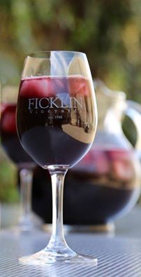 A frosted pitcher and wine glass of Ficklin Port over ice that's been served as Sangria.